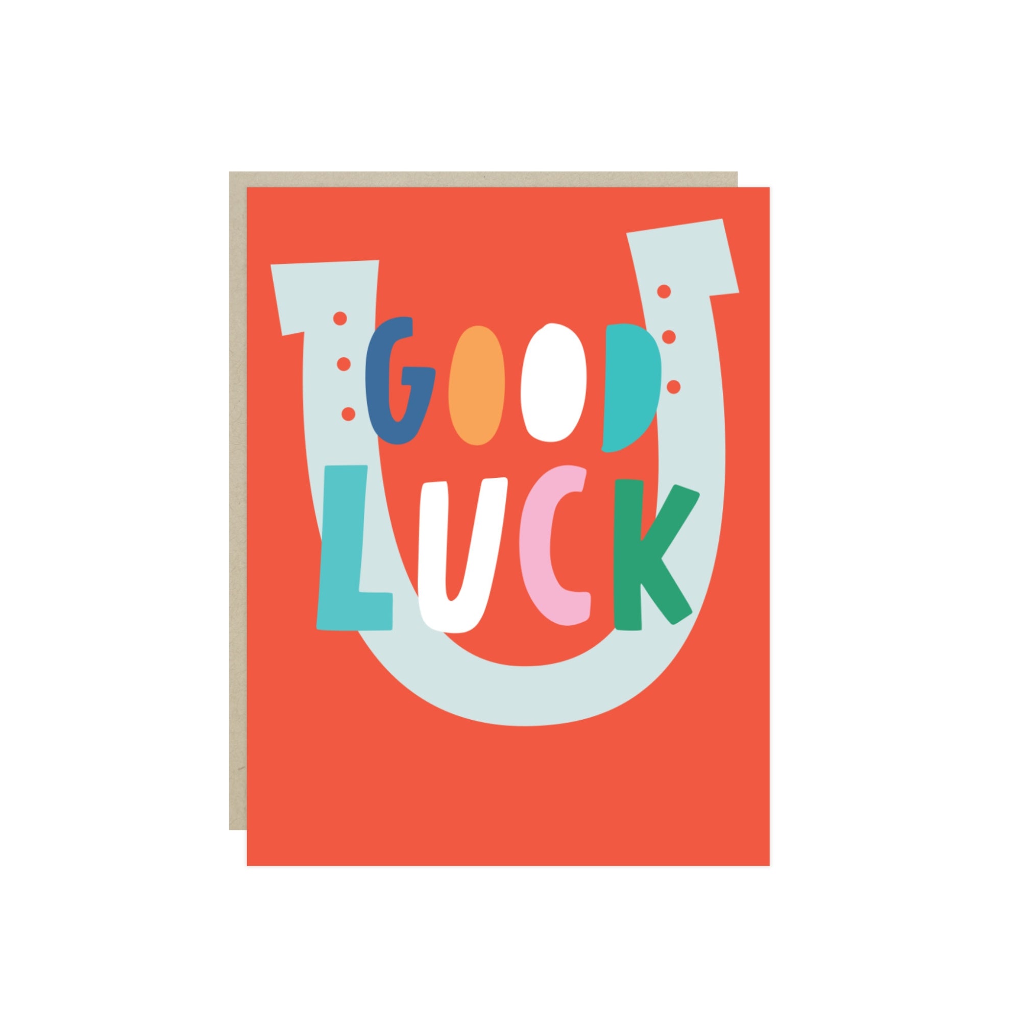 Good luck card with hand-lettered 'Good Luck' inside a horseshoe on a red background.