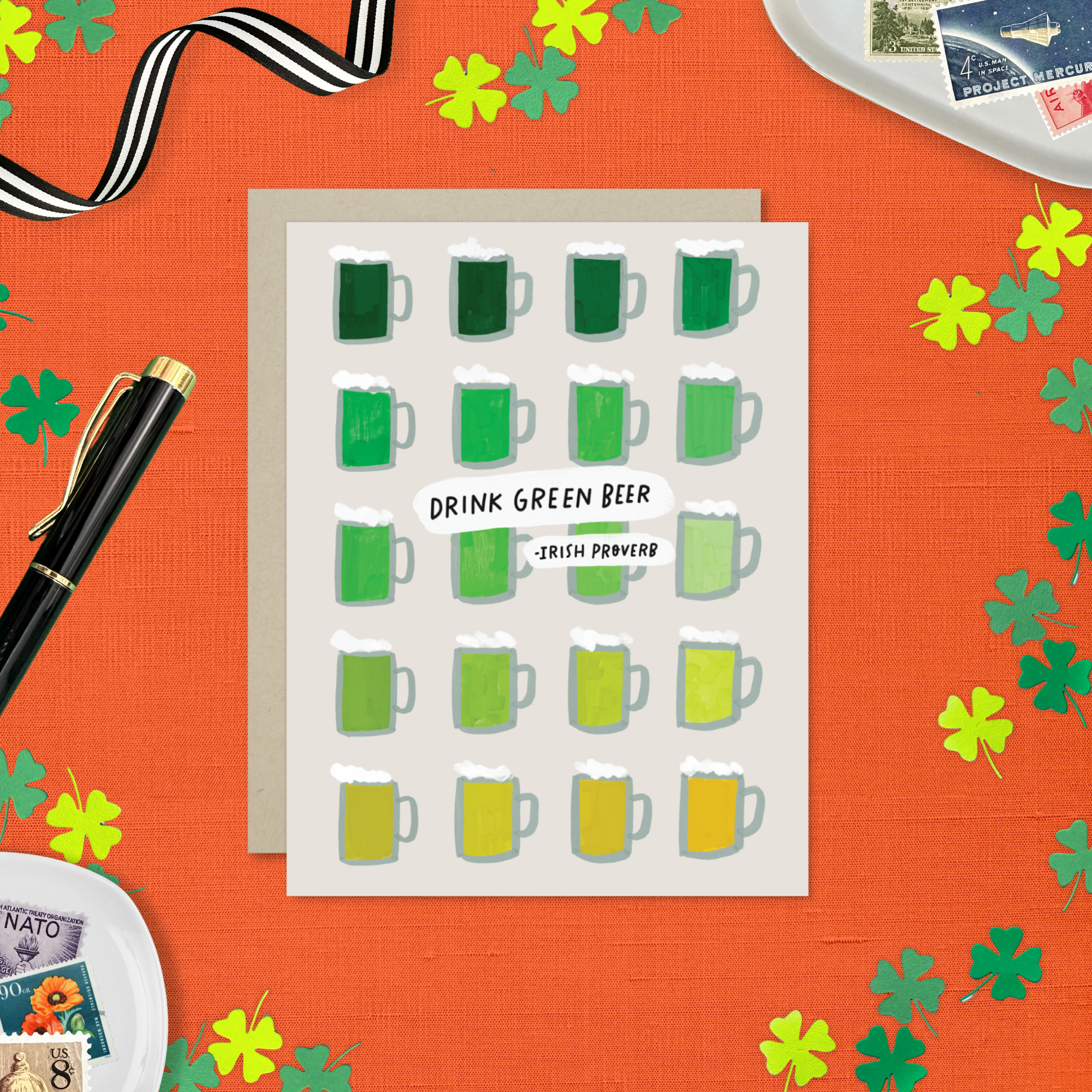 A st. patricks day greeting card with a grid of illustrated green beers in various shades and the text 'DRINK GREEN BEER - IRISH PROVERB'.