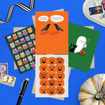 Collection of Halloween-themed cards featuring an adorable ghost with black cat and coffee, one with 2 funny ravens saying "Nevermore," one with a jack-o-lantern pattern, and one with an owl pattern and stamps on a blue background.