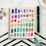 A colorful birthday card with paint swatch-like designs in various colors and the text 'Happy Birthday' on it.