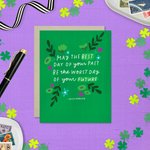 A St. Patricks day greeting card with floral patterns and a hand-lettered Irish proverb.
