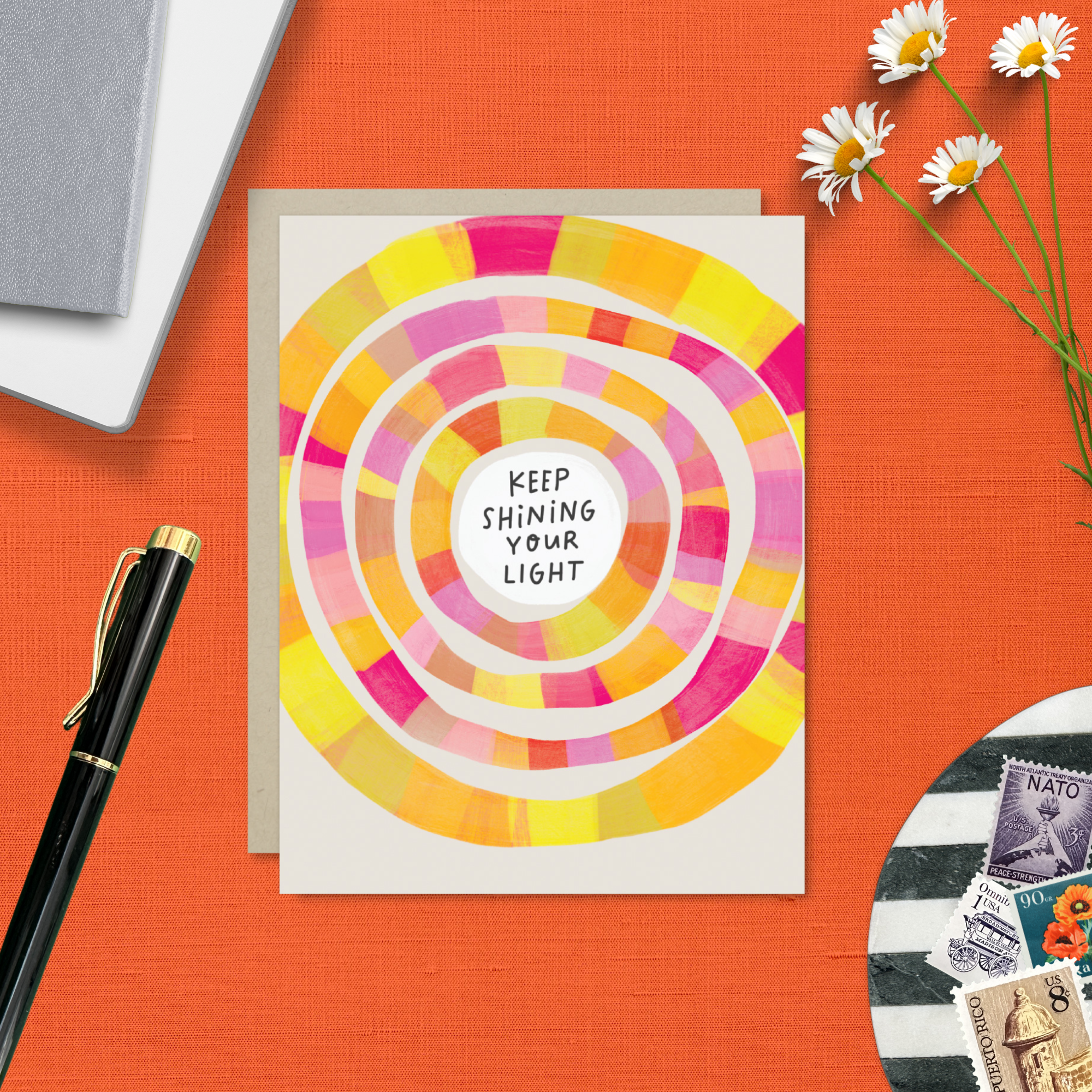 Encouragement Greeting card with colorful concentric circles and 'Keep Shining Your Light' text.