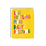 Greeting card with hand-lettered text “Less Hustling, More Dilly-Dallying” on bright yellow painterly background
