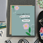 Sympathy greeting card with 2 flowers and 'those who touch your heart will live on forever' text