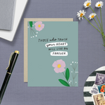 Sympathy greeting card with 2 flowers and 'those who touch your heart will live on forever' text