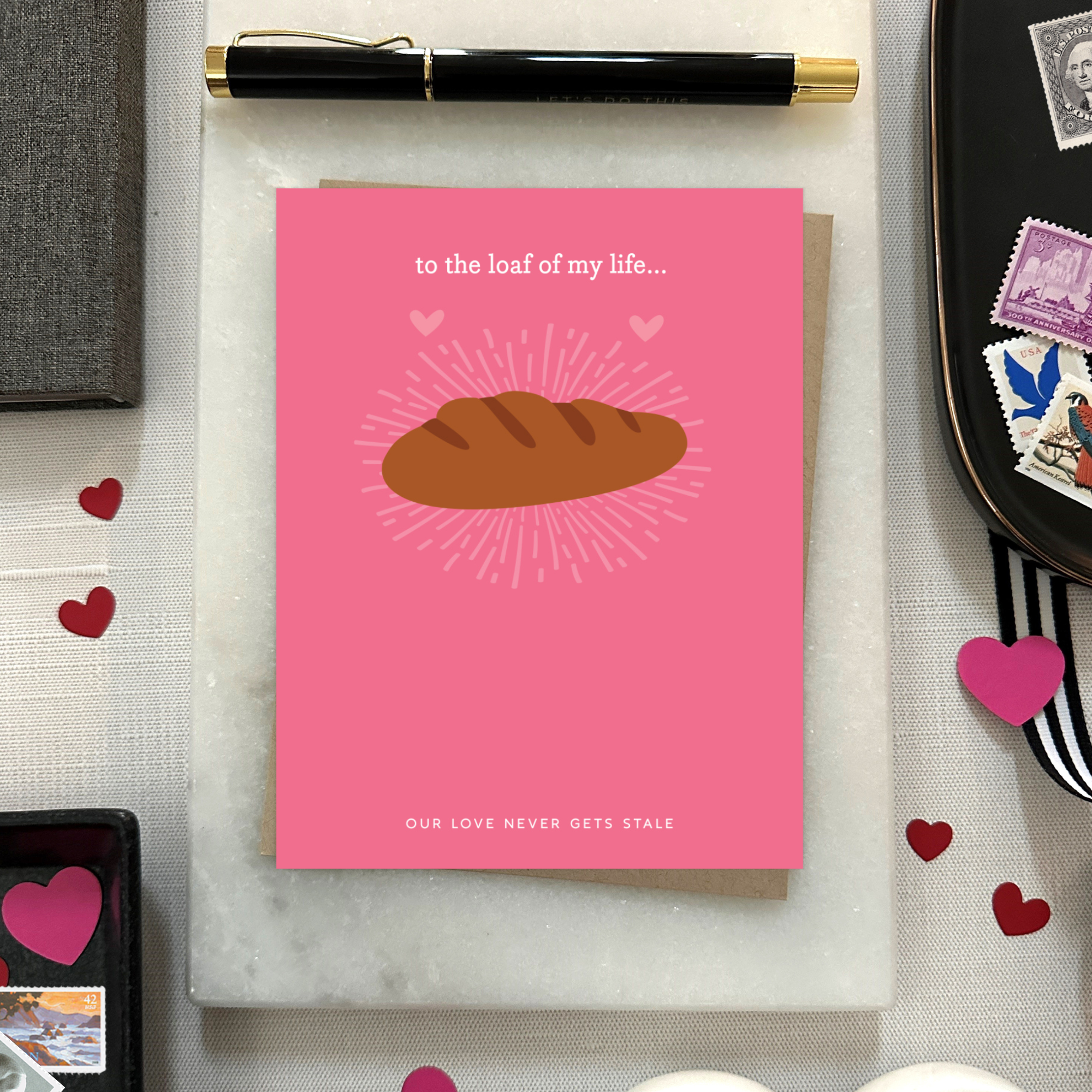 A Valentine's day greeting card with a illustration of a loaf of bread and the text 'to the loaf of my life... Our love never gets stale.'
