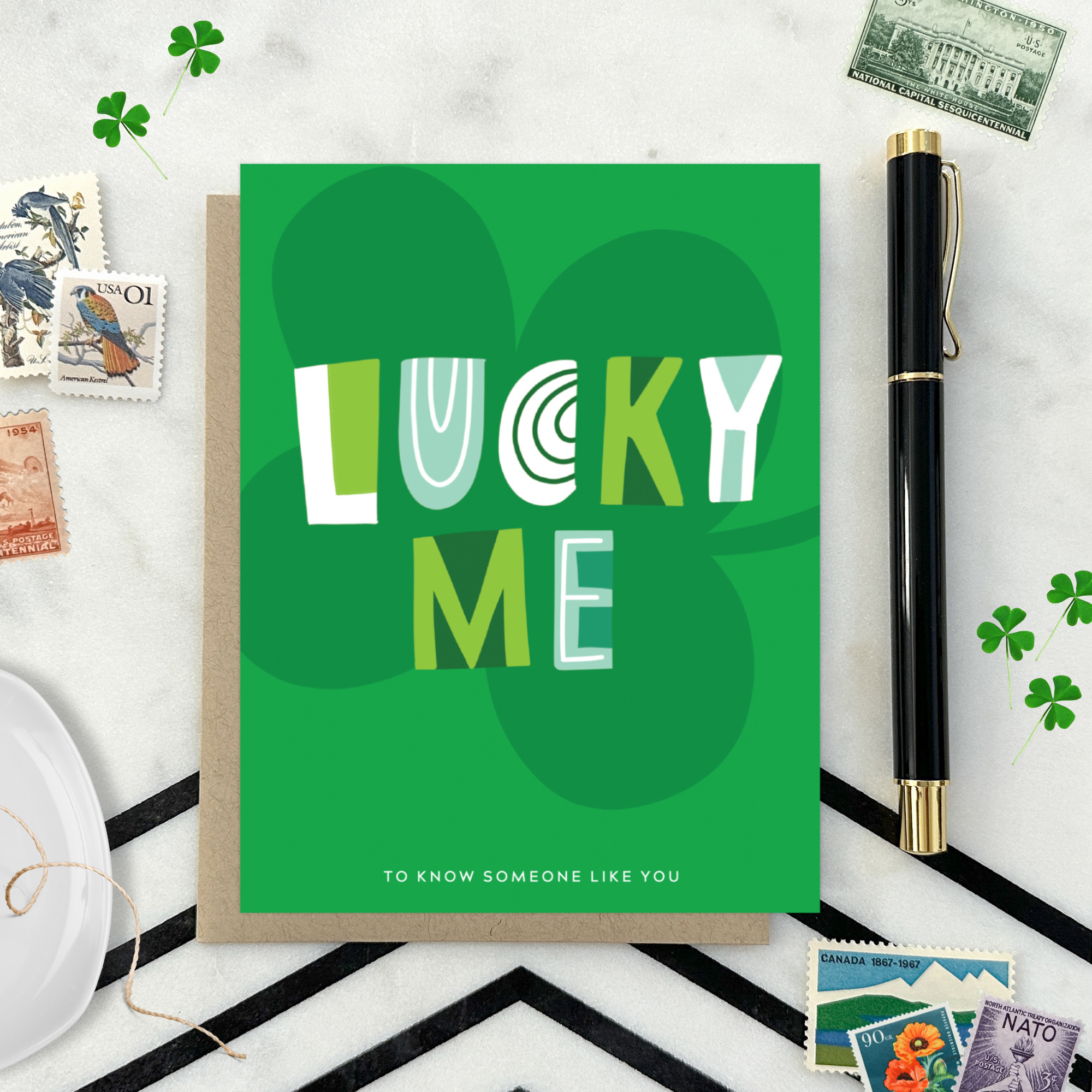 A st. patricks day greeting card with the text 'LUCKY ME' accompanied by the phrase 'TO KNOW SOMEONE LIKE YOU' on a background featuring a four-leaf clover 