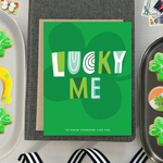 A st. patricks day greeting card with the text 'LUCKY ME' accompanied by the phrase 'TO KNOW SOMEONE LIKE YOU' on a background featuring a four-leaf clover 