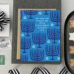 Hannukah greeting card with menorahs and stars of David scattered with 'may your year be bright and joyful & your home be filled with love' text