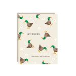 Funny greeting card with illustration of chaotic ducks and humorous text about letting go of perfection