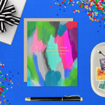 A colorful birthday greeting card with a hand-painted abstract design and gold foil lettering that reads 'May All Your Birthday Wishes Come True'.