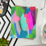 A colorful birthday greeting card with a hand-painted abstract design and gold foil lettering that reads 'May All Your Birthday Wishes Come True'.
