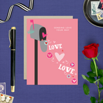 A Valentine's Day greeting card featuring a whimsical mailbox overflowing with love and playful hearts