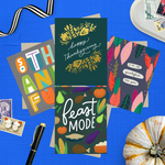 Collection of Thanksgiving-themed greeting cards on a blue background with decorative elements featuring "I'm so grateful for you," "Happy Thanksgiving," "Feast Mode," and "So Thankful." 
