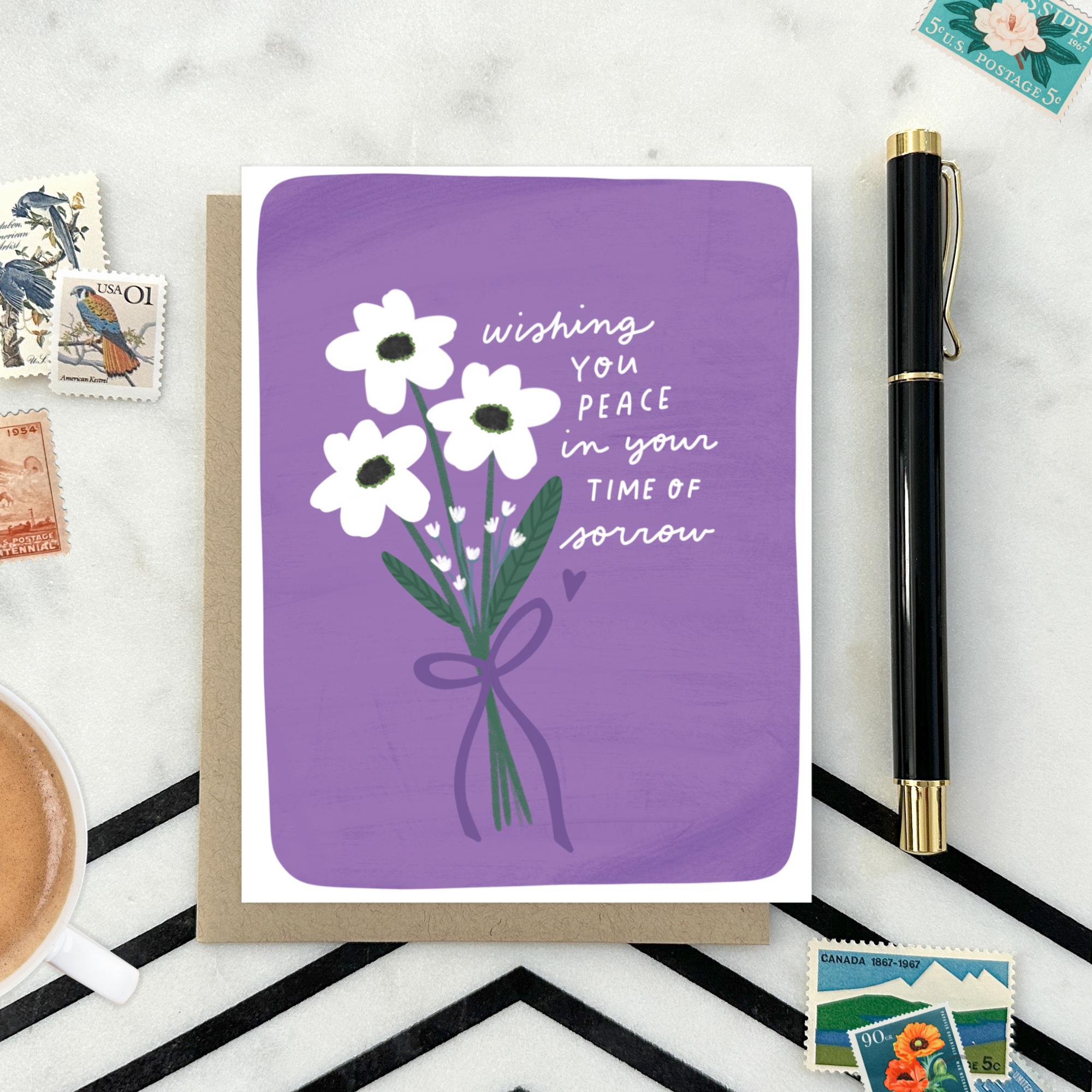 Sympathy greeting card with white flowers and "wishing you peace in your time of sorrow" text