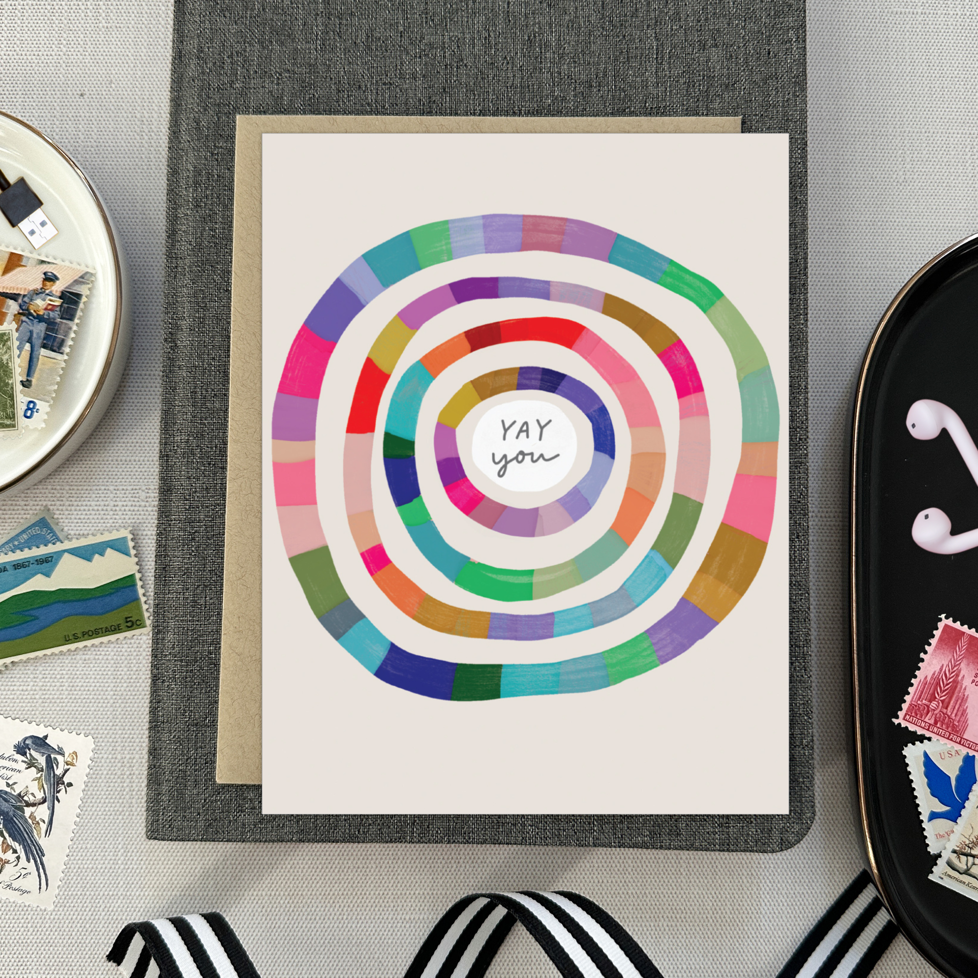 Congratulations greeting card with colorful concentric circles around the text 'yay you'