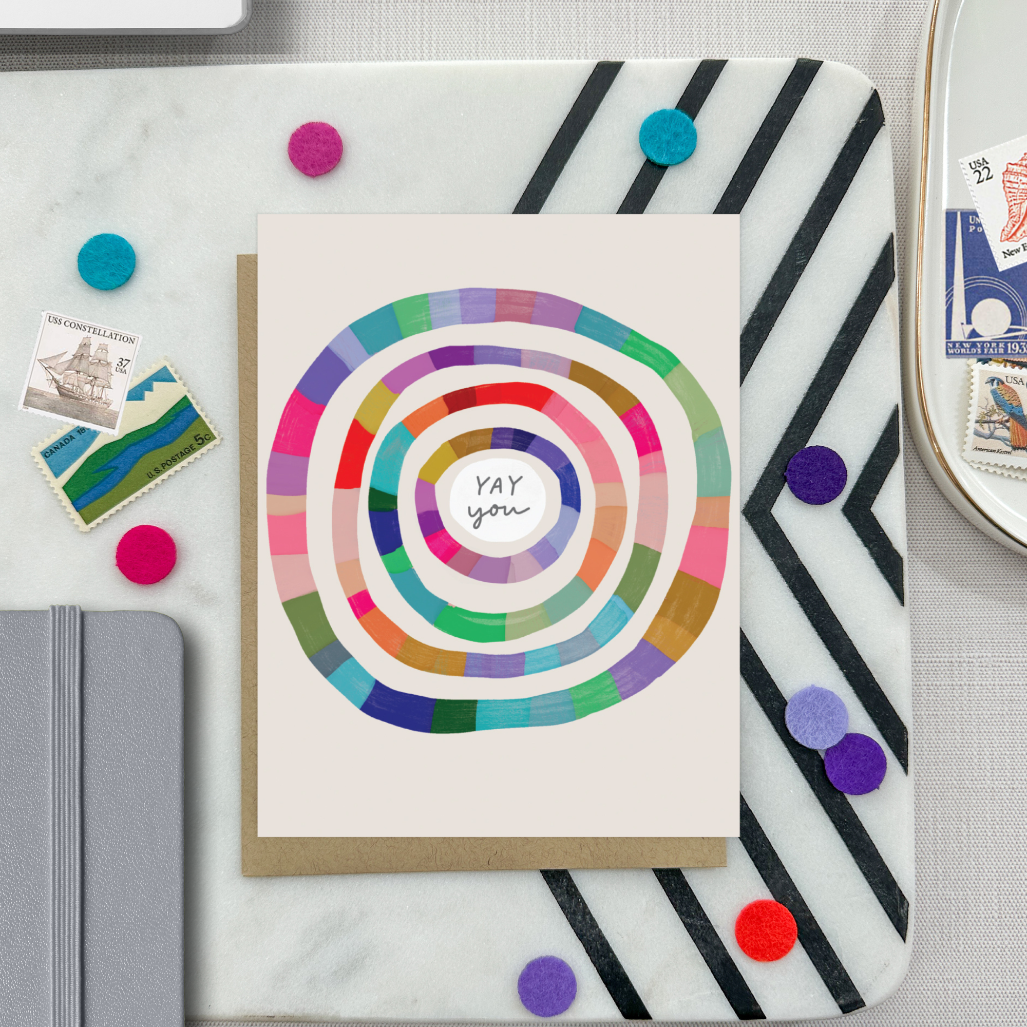 Congratulations greeting card with colorful concentric circles around the text 'yay you'