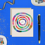 Congratulations greeting card with colorful concentric circles around the text 'yay you'